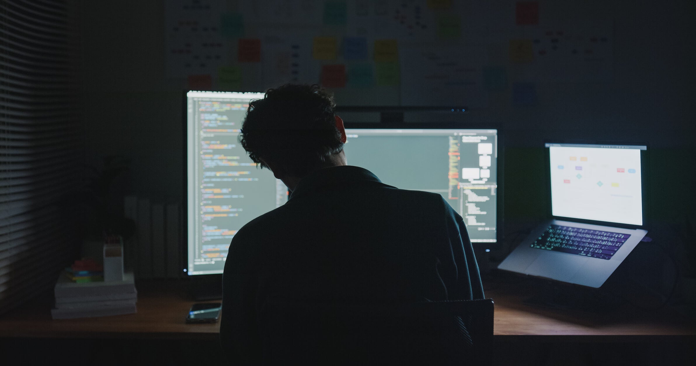 Man at his desk at night